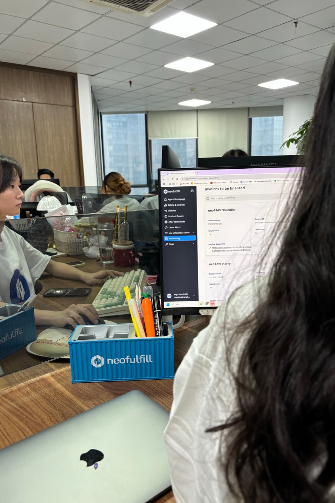 A Neofulfill team member working at a desk in the Shenzhen office.